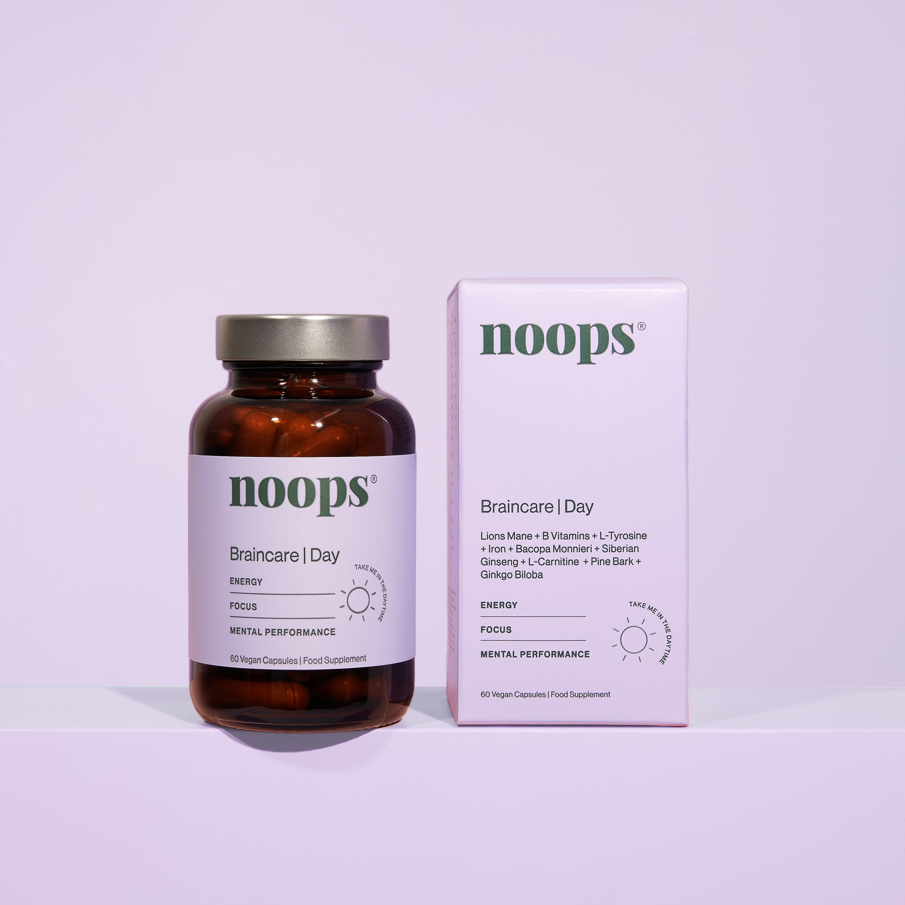 A bottle and box of noops nootropics Braincare supplements on a light lilac background. Use this vegan and science backed formula to support focus, energy, memory and cognative function